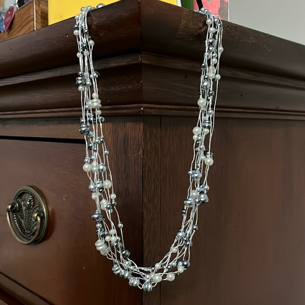 Black and silvered pearl necklace.